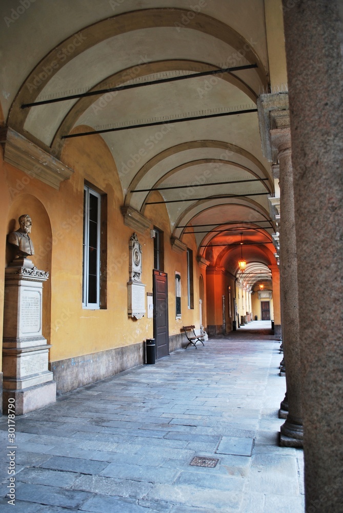 Courtyard and arcade in famous Pavia university, Lombardy, Italy