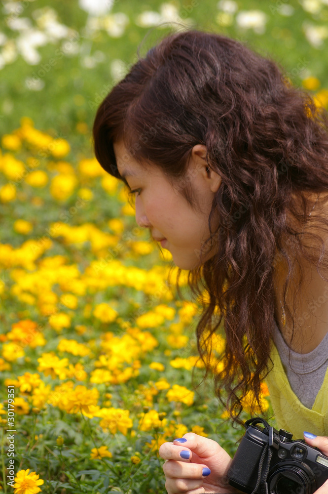 Girl looking at flower Girl looking at flower