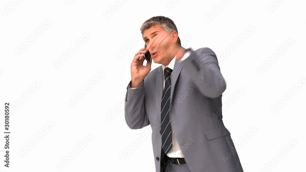 Businessman getting nervous on phone Businessman getting nervous on phone