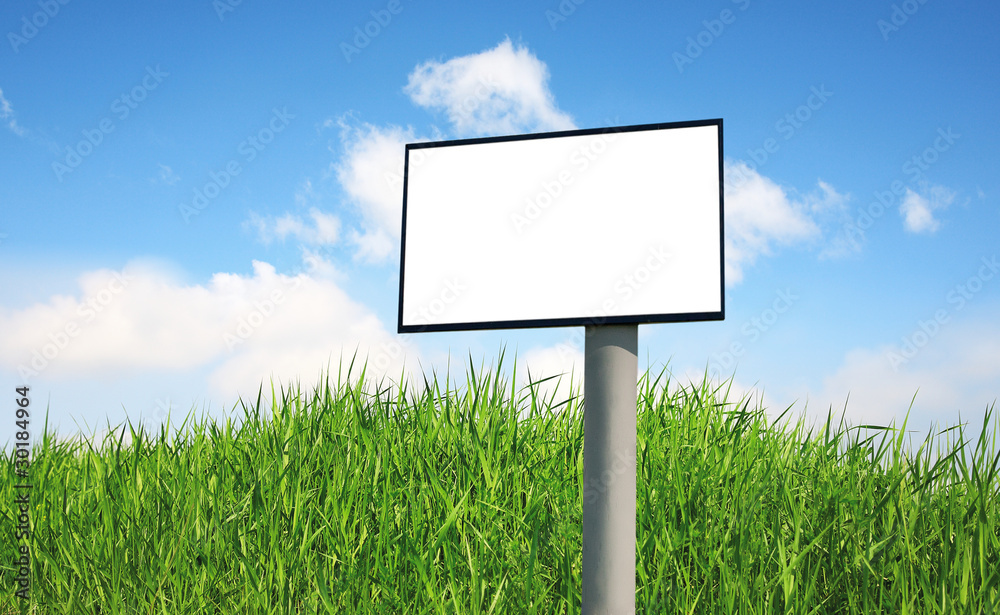 Advertising billboard on a green grass