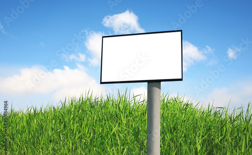 Advertising billboard on a green grass