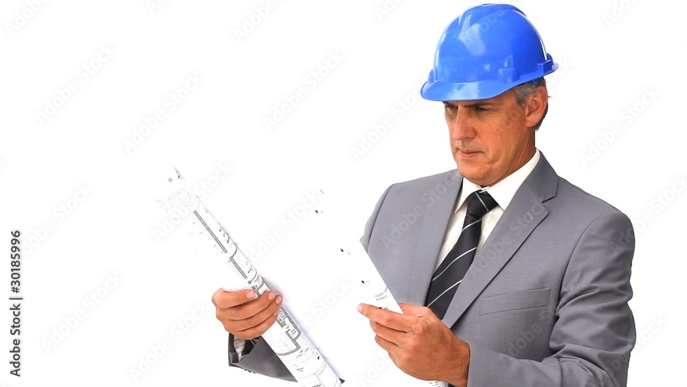 Architect looking at his construction plan Architect looking at his construction plan