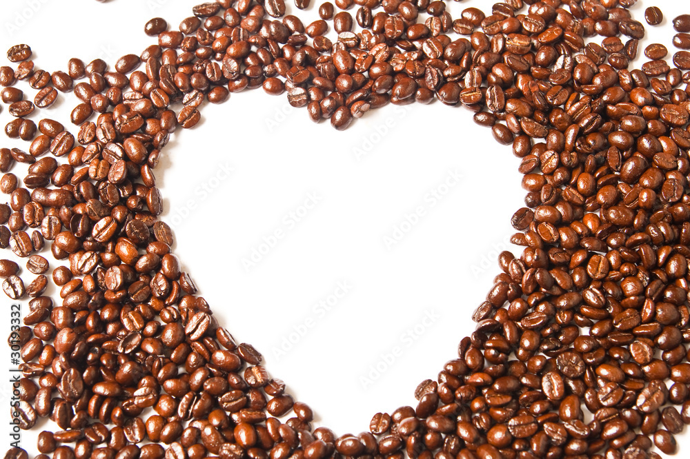 Heart from brown coffee beans on white background Heart from brown coffee beans on white background