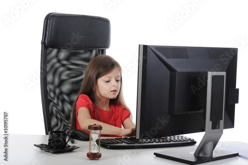 Little girl in the office computer.