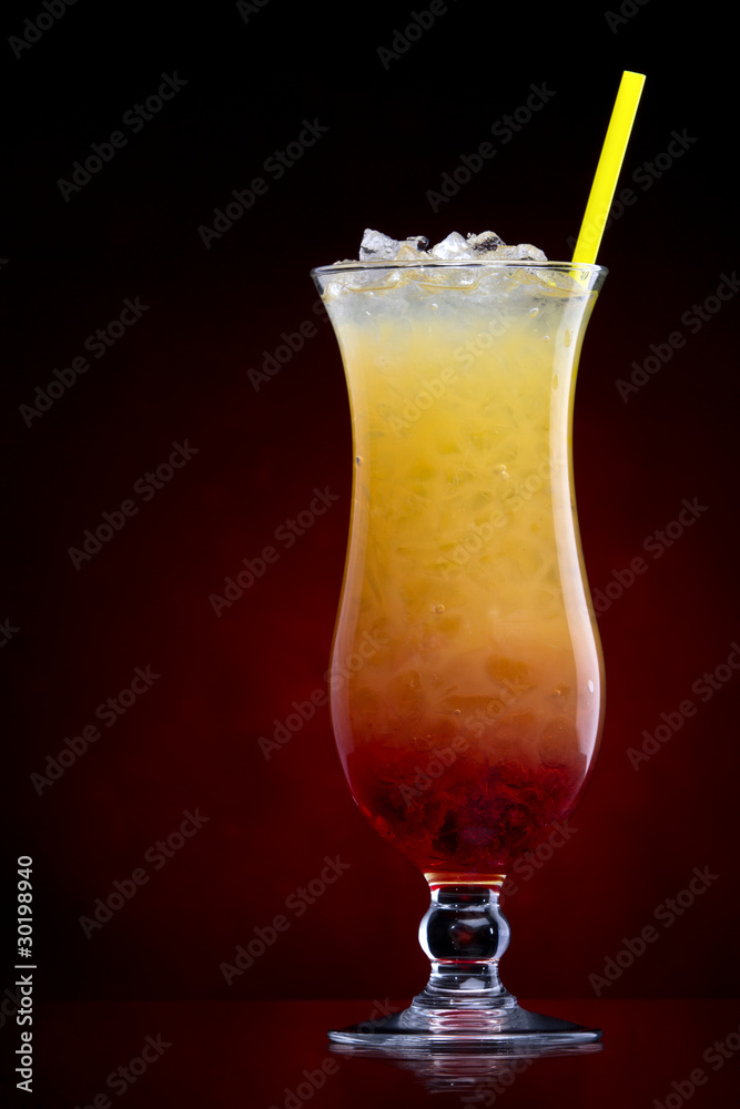 Tequila sunrise Cocktail isolated on a Red Tequila sunrise Cocktail isolated on a Red