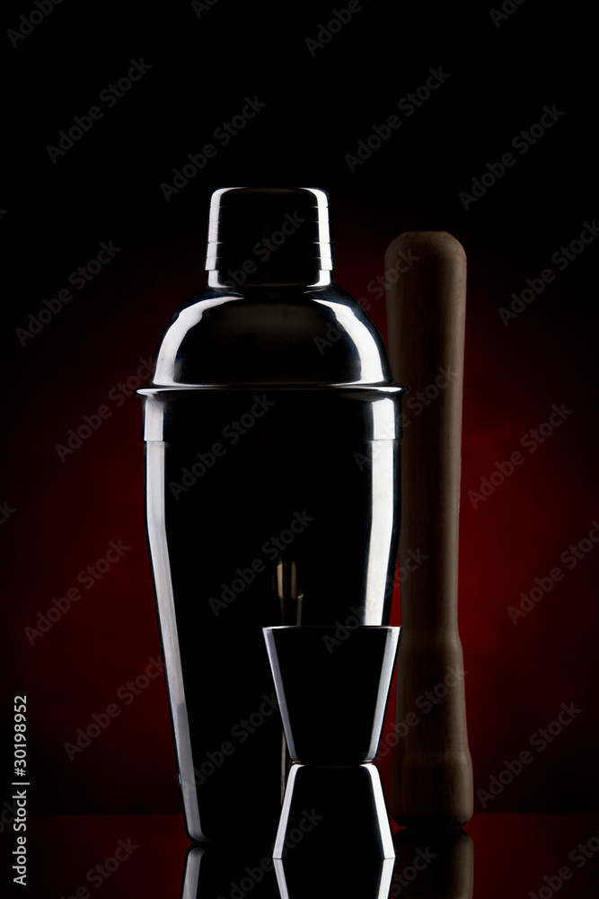 stainless steel cocktail shaker on a red gradient stainless steel cocktail shaker on a red gradient