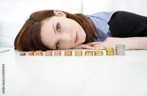 beautiful woman with growing money (focus on money)