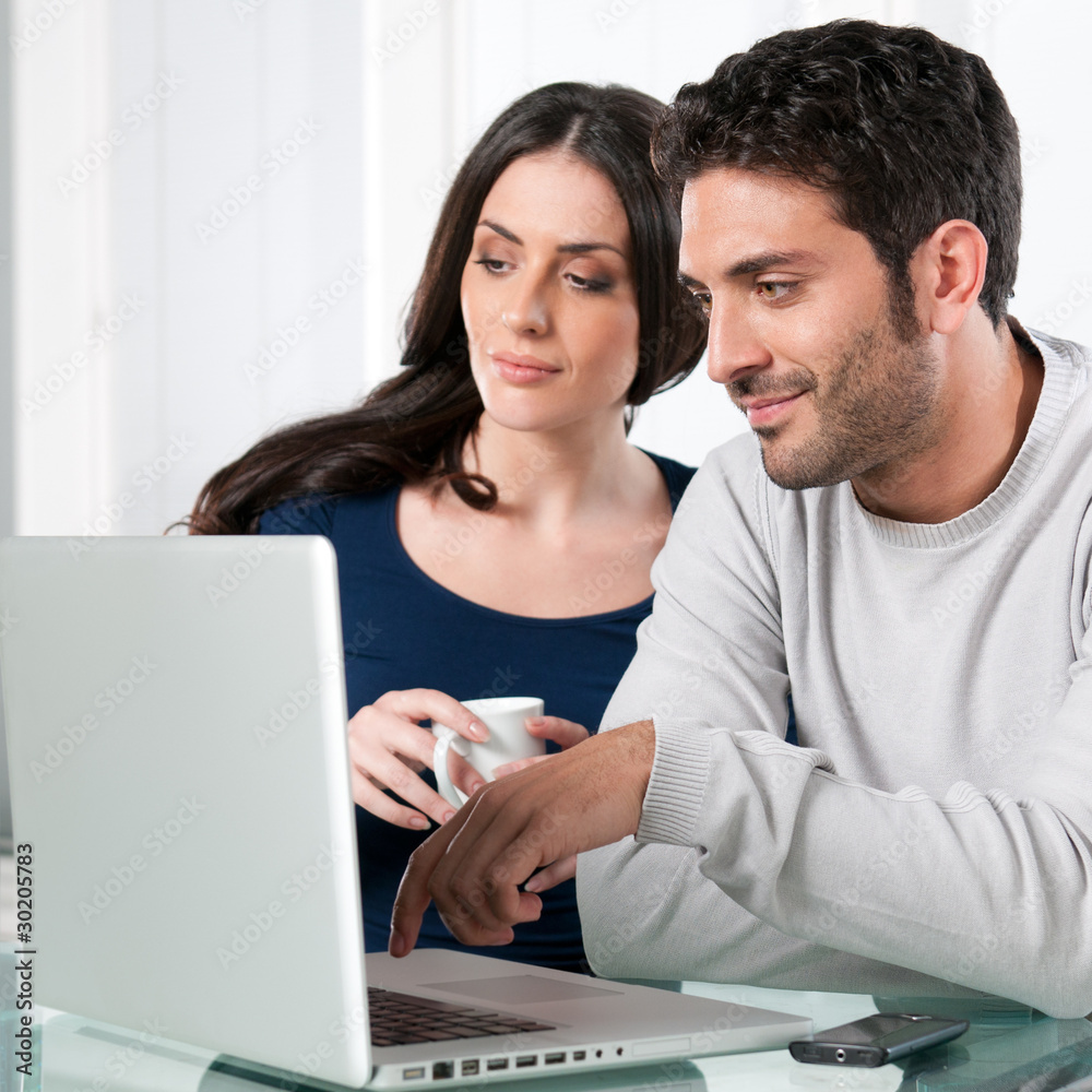 Couple with internet laptop Couple with internet laptop