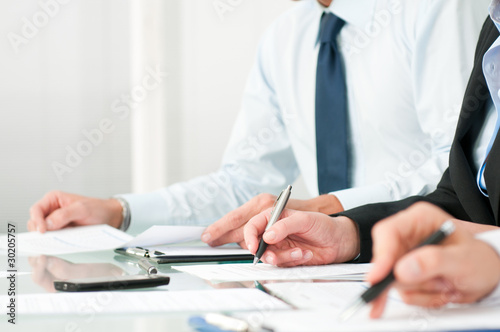 Business people taking notes
