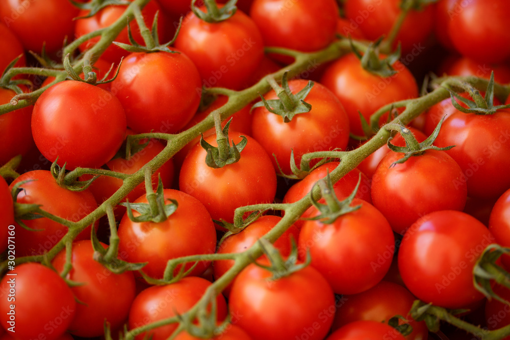 Red tomatoes closeup at a market place
