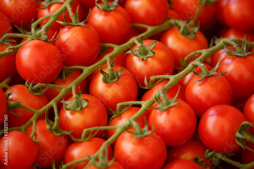 Red tomatoes closeup at a market place © Eugenia Struk