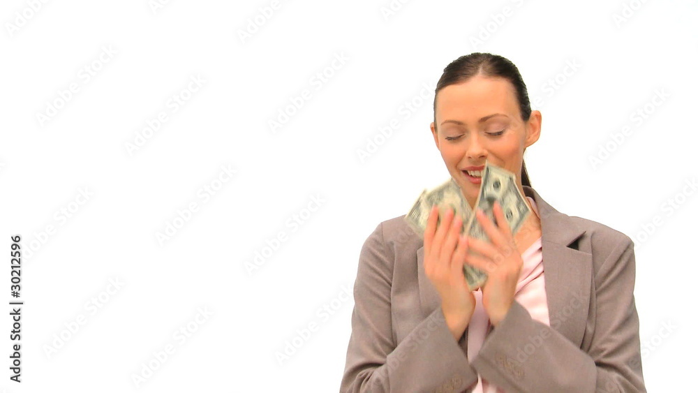 Businesswoman counting her money against a white background Businesswoman counting her money against a white background