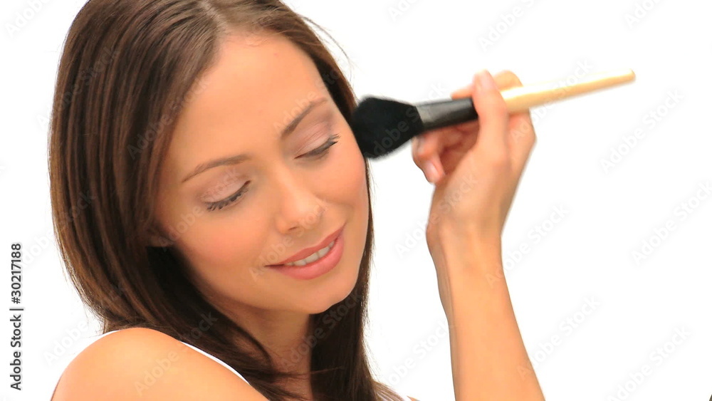 Wonderful brunette putting on make-up Wonderful brunette putting on make-up