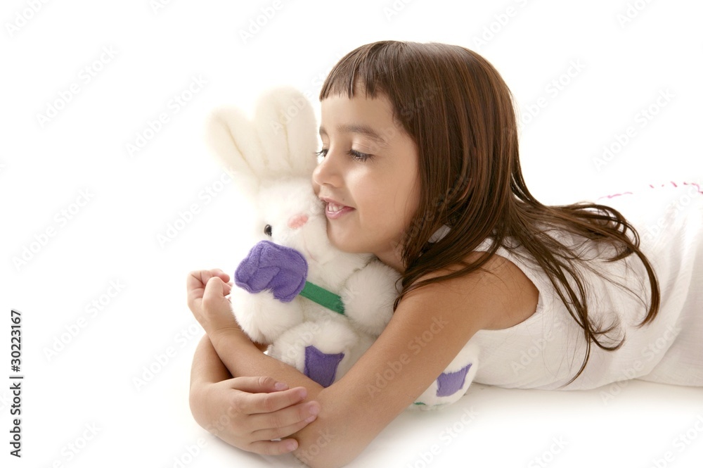 beautiful little latin girl with white  toy