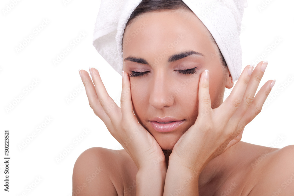 woman massaging her face woman massaging her face