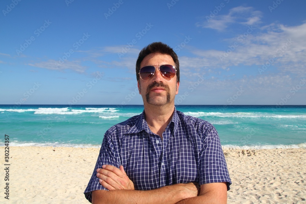 Nerd tourist mustache on caribbean beach