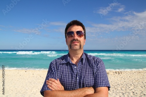 Nerd tourist mustache on caribbean beach
