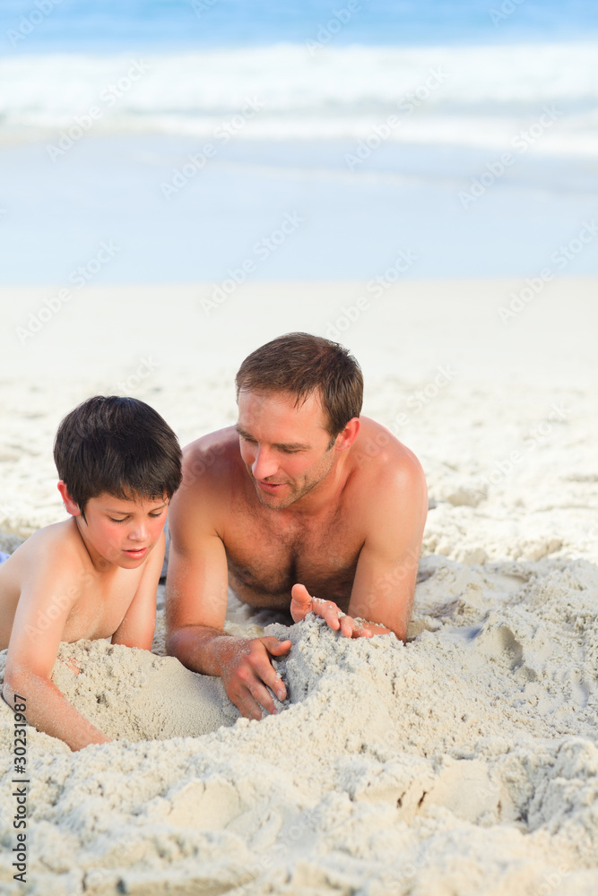 Fototapeta premium Father with his son on the beach