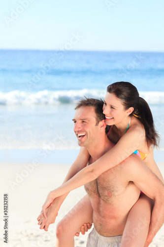 Man with his wife on the beach