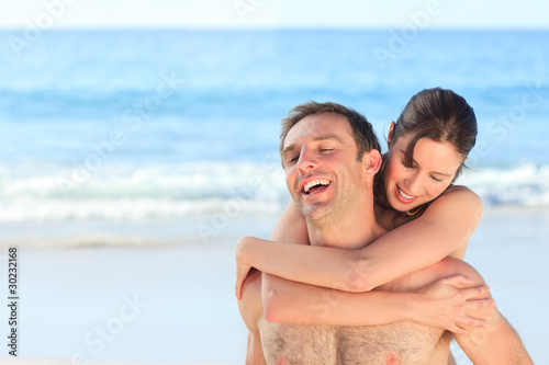 Woman with her husband on the beach
