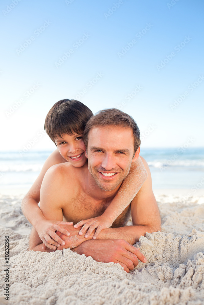 Father and his son at the beach