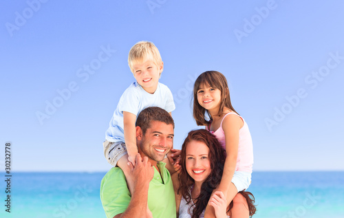 Happy children playing with their parents