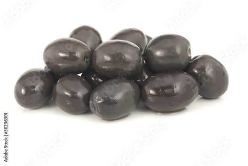 Whole black olives marinated isolated on white background