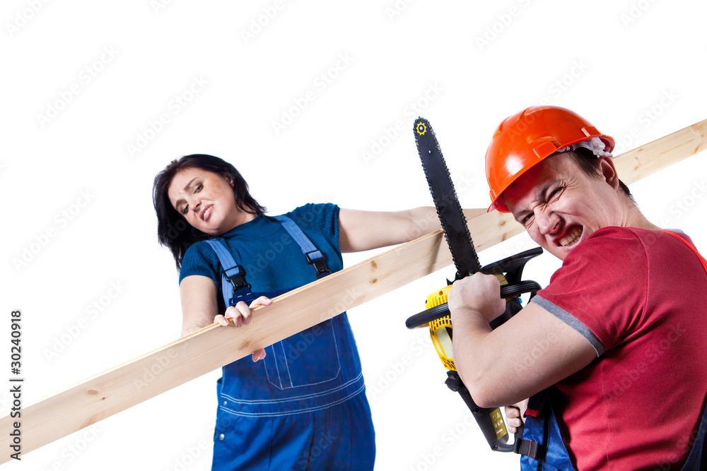 Workers are cutting linings with the chainsaw Workers are cutting linings with the chainsaw