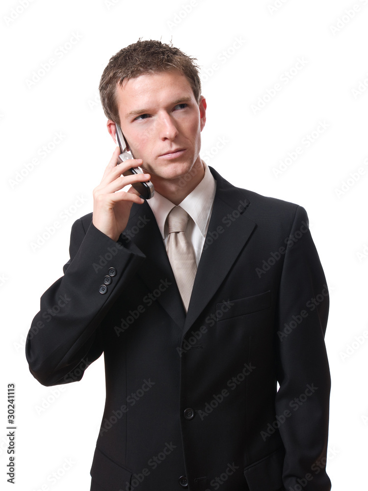 young serious businessman talking with cellphone young serious businessman talking with cellphone
