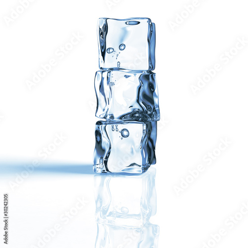 Pile of 3 blue ice cubes isolated on a reflecting white table