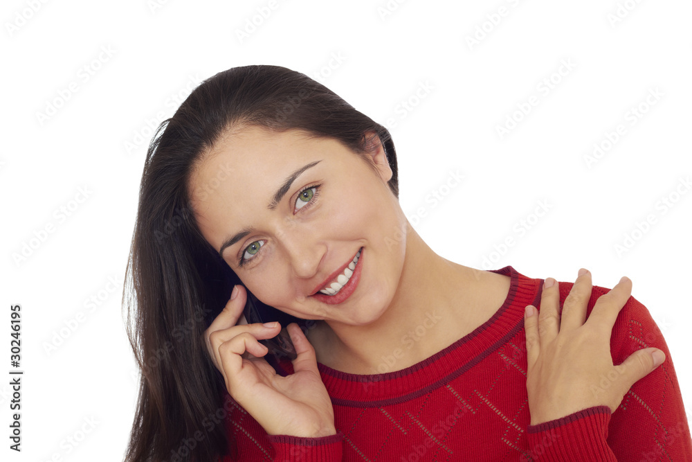 Young beautiful woman in red sweater talks on cellular telephone Young beautiful woman in red sweater talks on cellular telephone