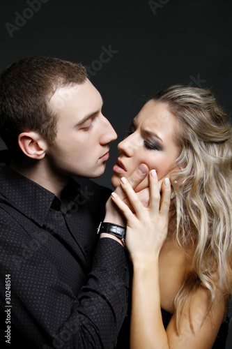 handsome man is about to kiss a beautiful woman