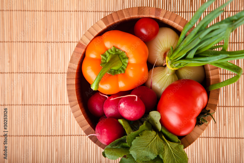 Different ripe vegetables compositions in studio on bamboo Different ripe vegetables compositions in studio on bamboo