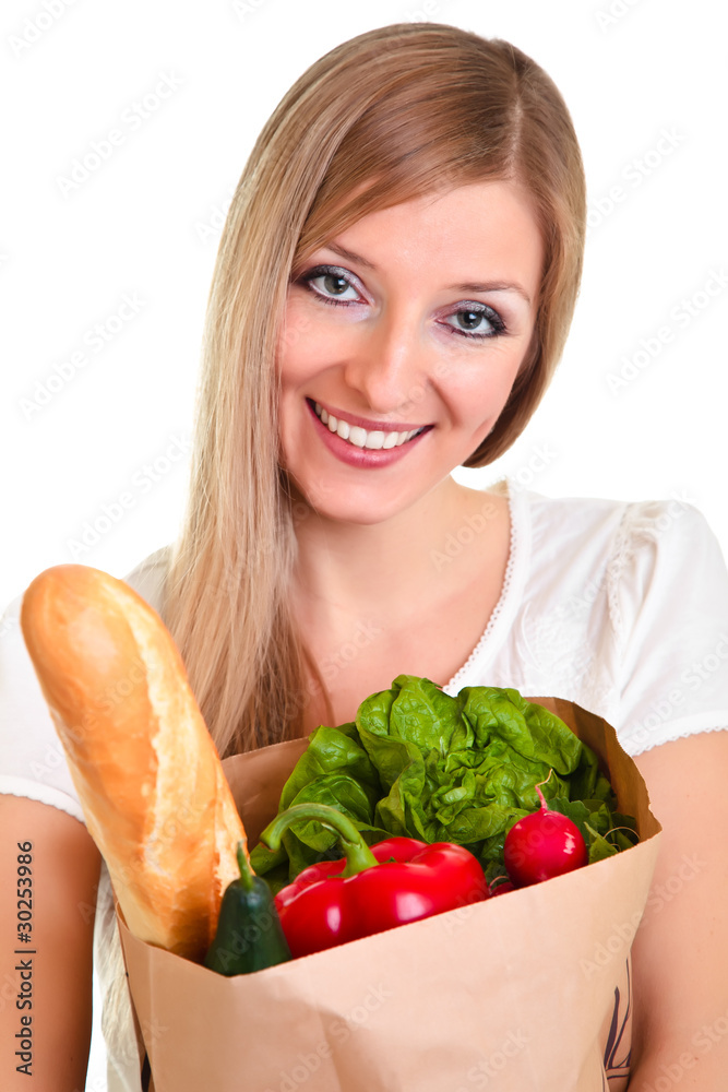 Woman carrying bag of groceries isolated on white Woman carrying bag of groceries isolated on white
