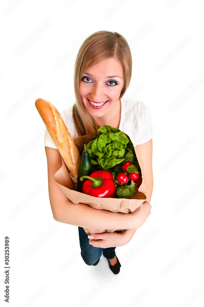 Woman carrying bag of groceries isolated on white Woman carrying bag of groceries isolated on white