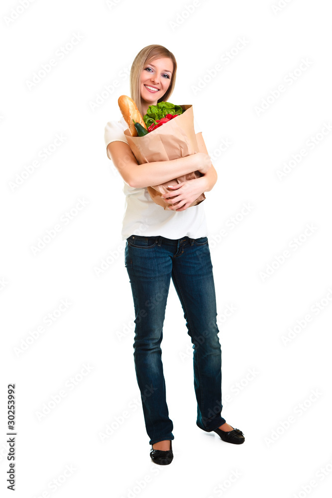 Woman carrying bag of groceries isolated on white Woman carrying bag of groceries isolated on white