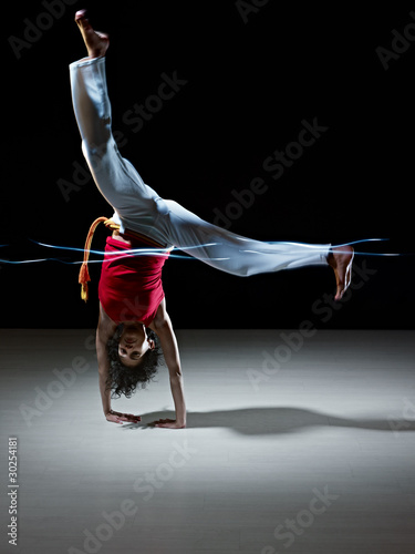 hispanic woman doing capoeira martial art