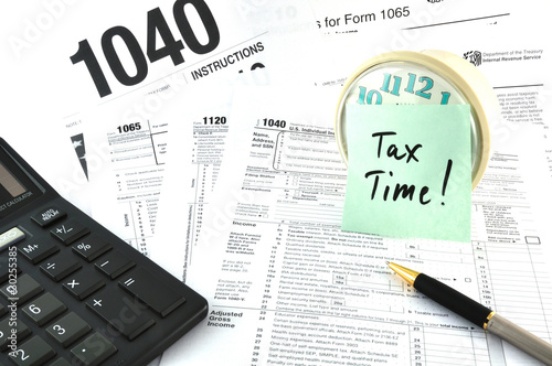 Tax Time. The Concept Image with a calculator and  a clock.