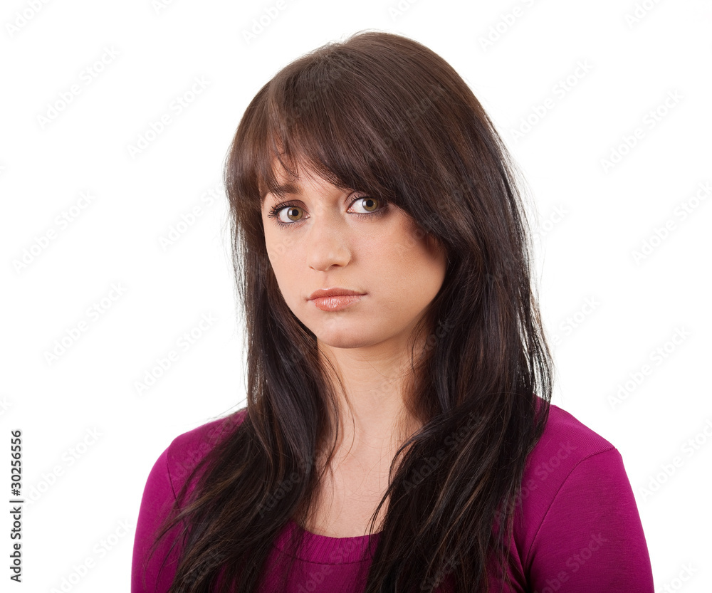 Fototapeta premium Serious girl in a red shirt on white background