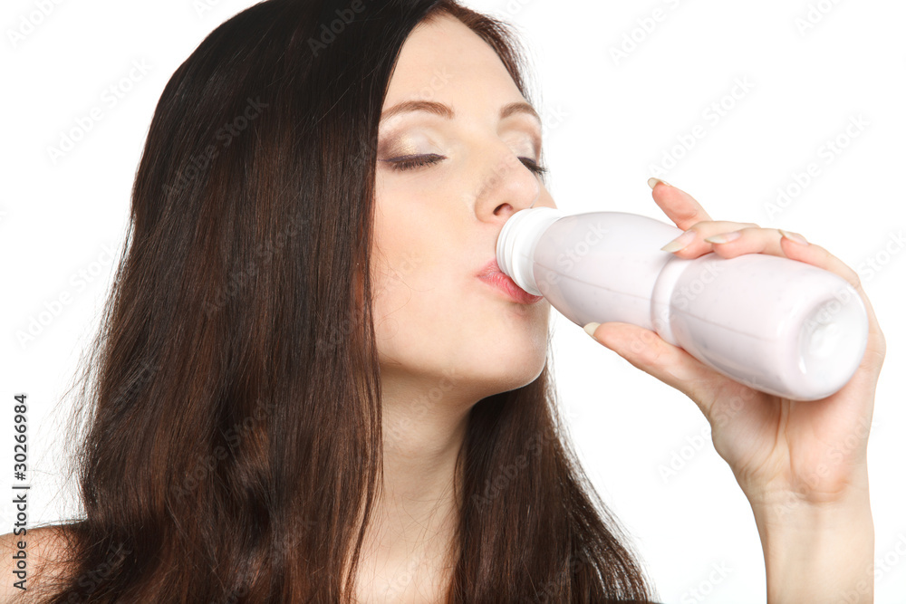 Young female enjoying taste of yogurt isolated on white Young female enjoying taste of yogurt isolated on white