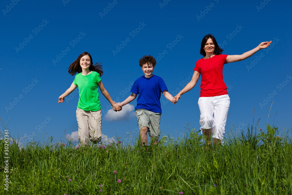 Active family - mother and kids running outdoor Active family - mother and kids running outdoor