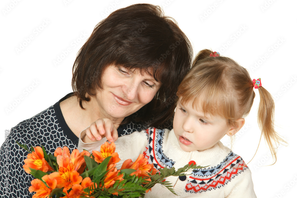 Grandmother and granddaughter intently looking petals Grandmother and granddaughter intently looking petals