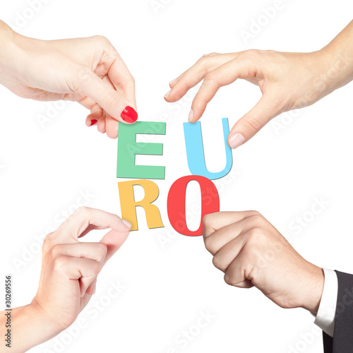 Team holding together letters forming the word euro