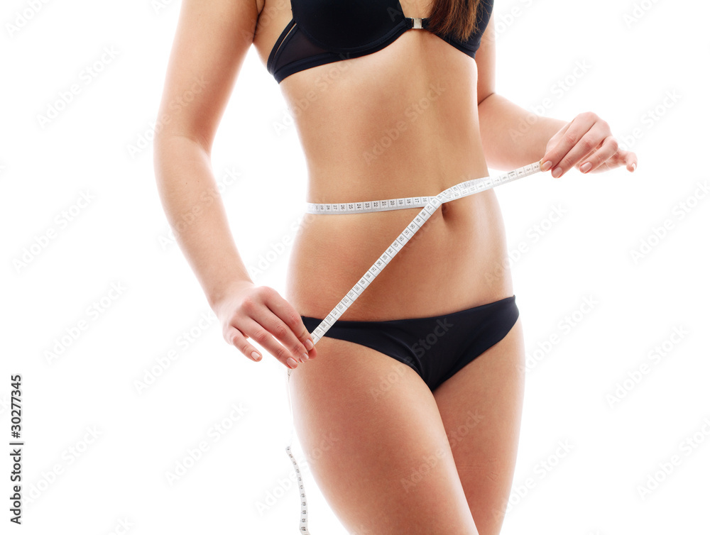 Woman measuring her torso