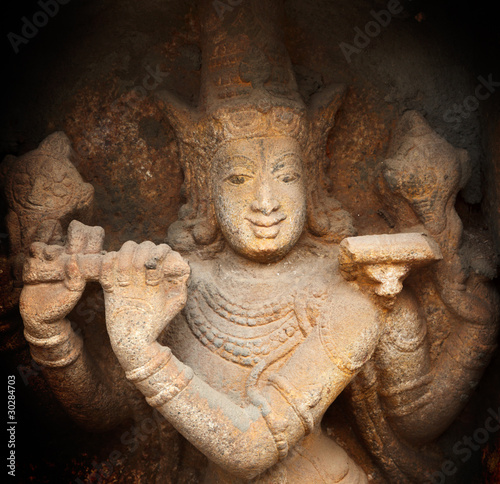 Krishna bas relief in Hindu temple photo