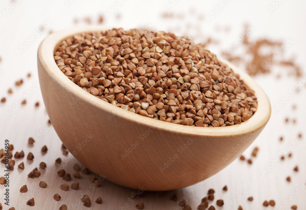 raw buckwheat in bowl raw buckwheat in bowl