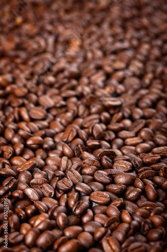 roasted coffee beans background © Olga Miltsova