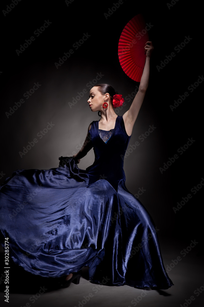 young woman dancing flamenco on black - obrazy, fototapety, plakaty 