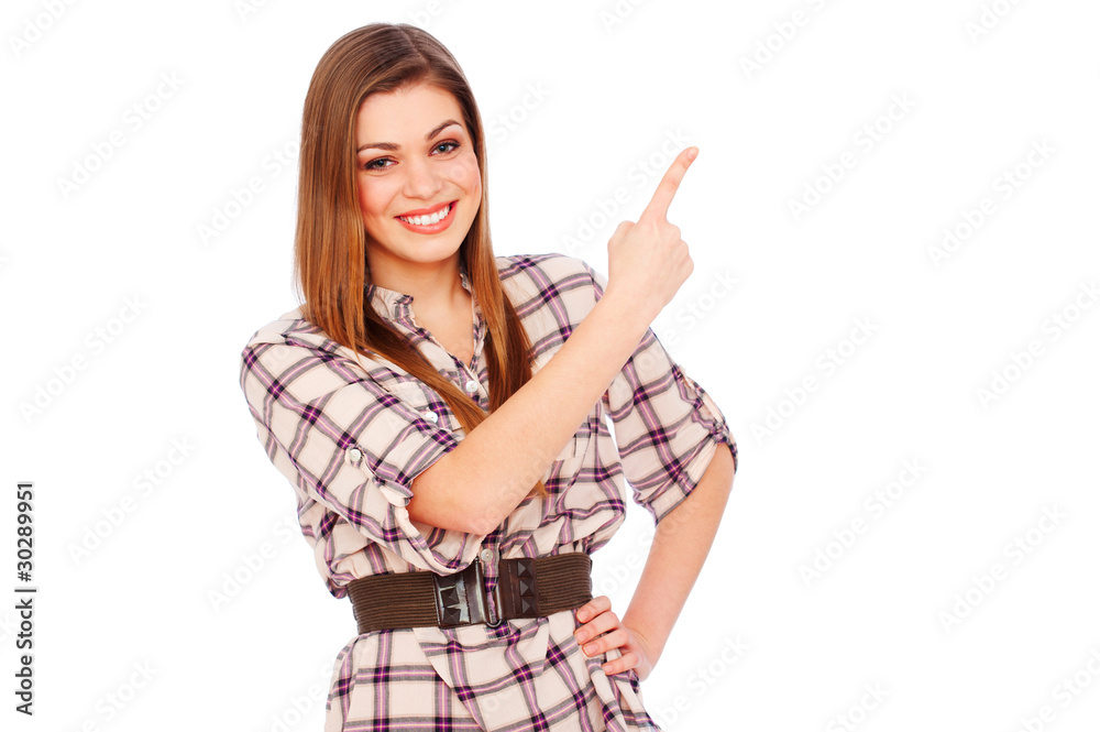 happy girl pointing at white copyspace happy girl pointing at white copyspace