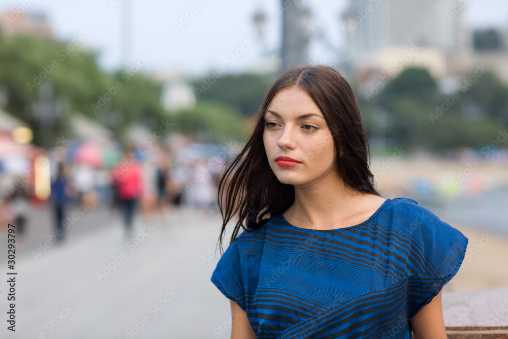 Attractive girl on the waterfront in Vladivostok. Russia.